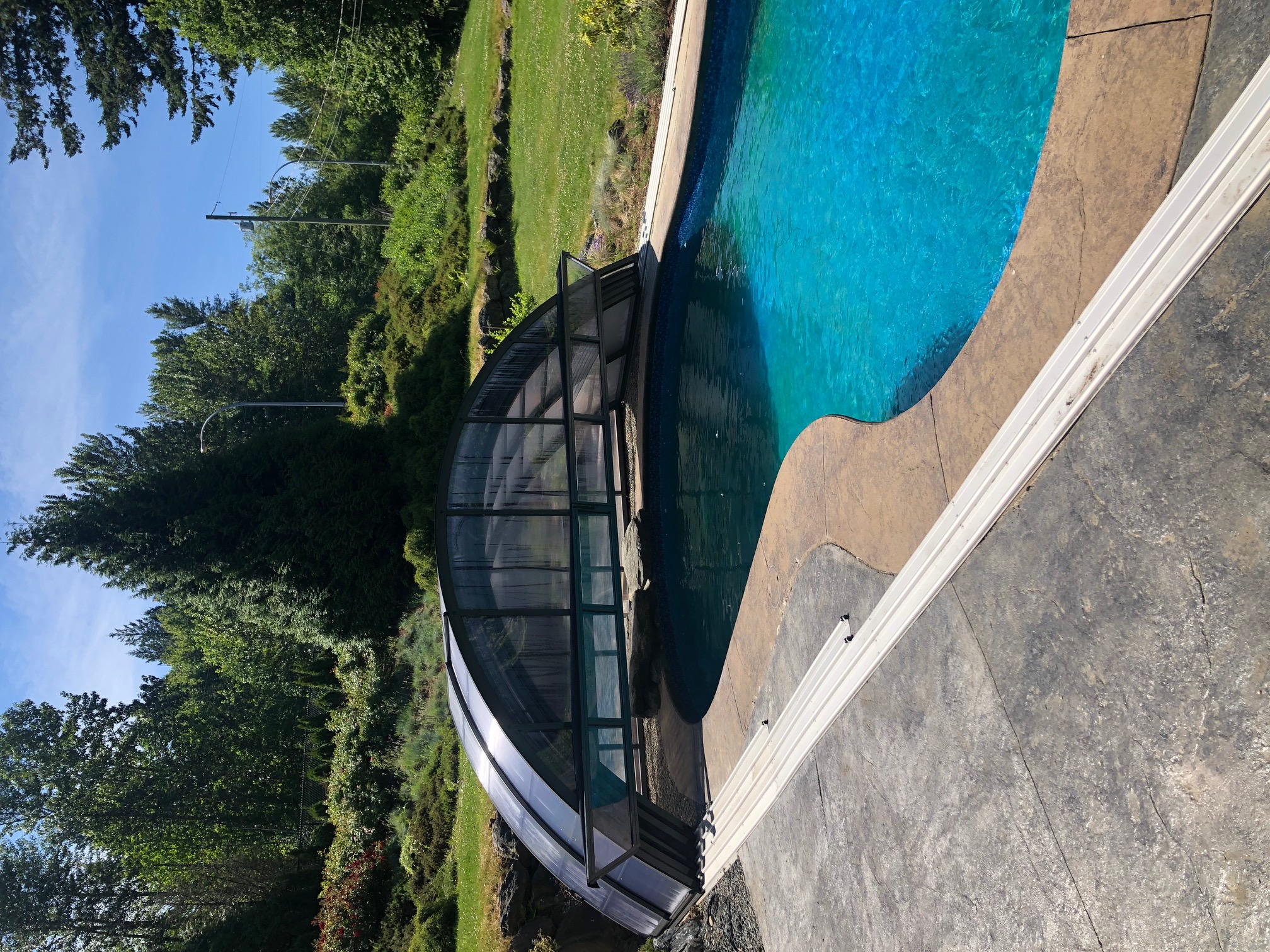 Pool enclosure parked over the pool